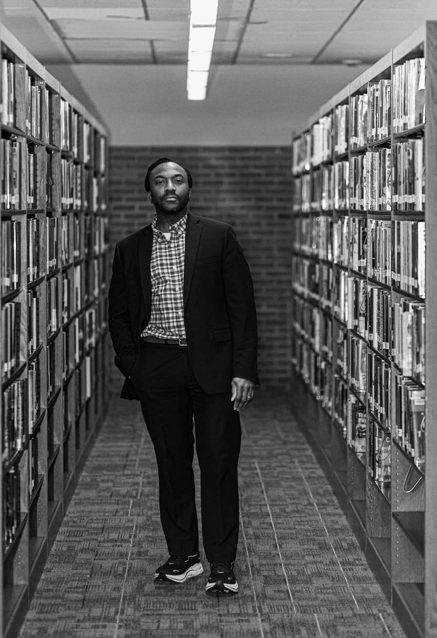 Dr. Adam Stevens in a library
